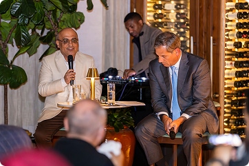 Rohit Arora speaking with microphone